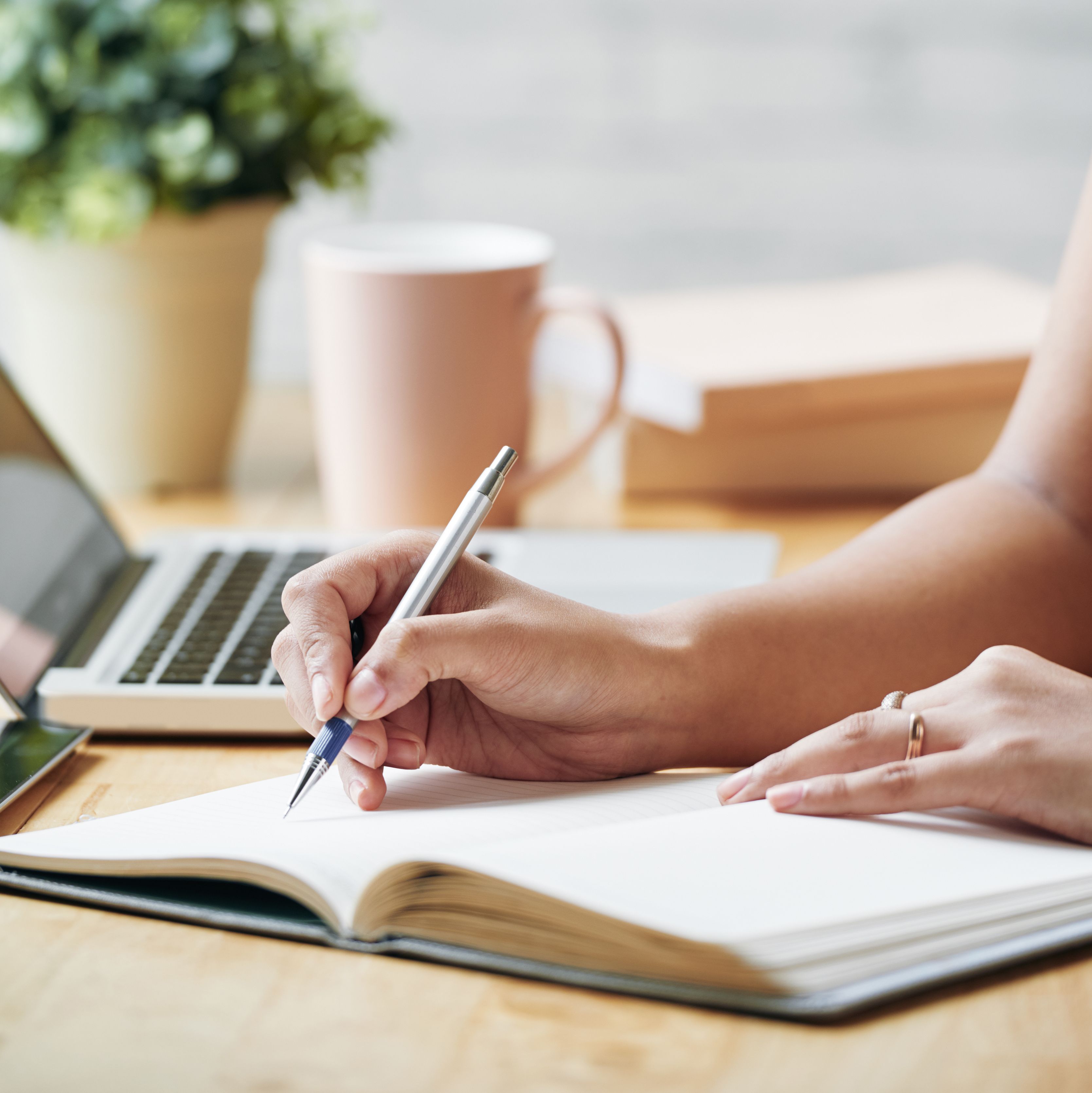 Unrecognizable Woman Sitting Desk Indoors Writing Planner